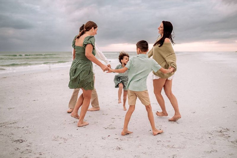 Kayley playing on the beach with kids